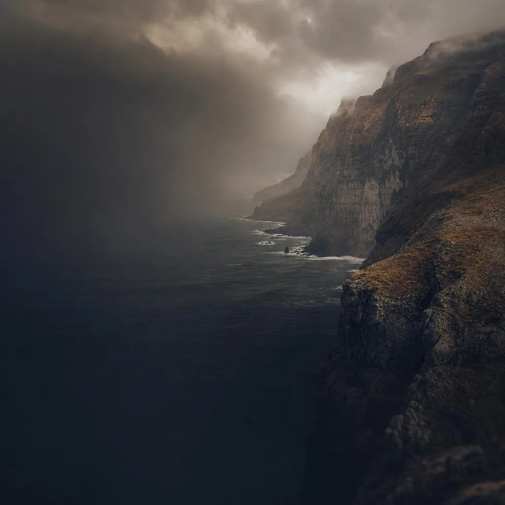 A sweeping vista of storm-wracked cliffs at the edge of the open world